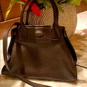 Tod’s mini clutch with shoulder strap.